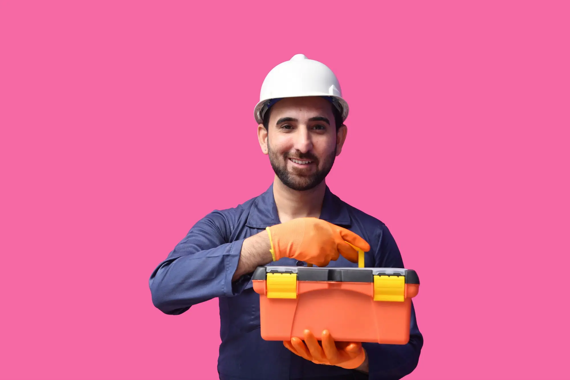Tradie holding a power drill on a job site